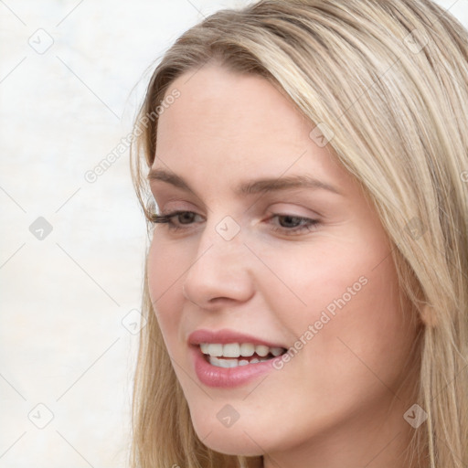 Joyful white young-adult female with long  brown hair and blue eyes