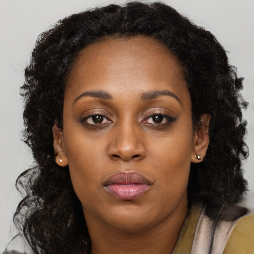 Neutral black adult female with long  brown hair and brown eyes