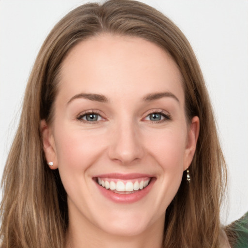 Joyful white young-adult female with long  brown hair and grey eyes