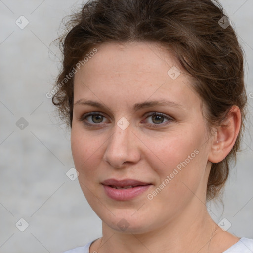 Joyful white young-adult female with medium  brown hair and green eyes