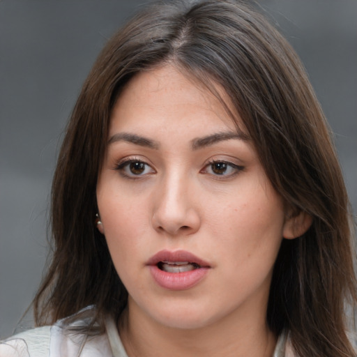 Neutral white young-adult female with medium  brown hair and brown eyes