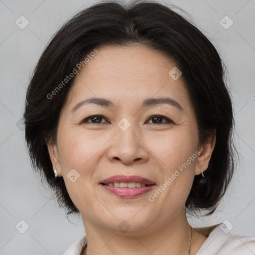 Joyful white adult female with medium  brown hair and brown eyes