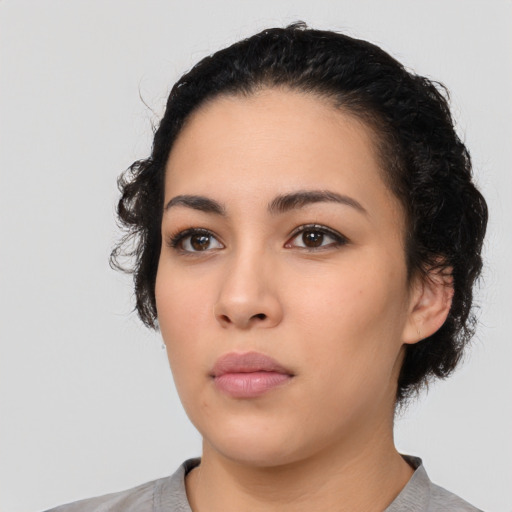 Neutral latino young-adult female with medium  black hair and brown eyes