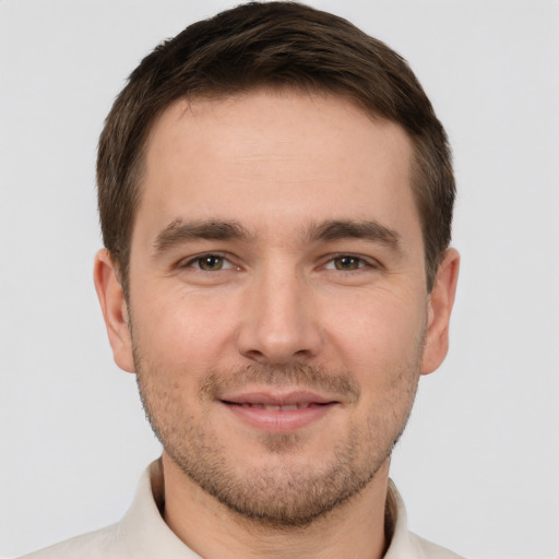 Joyful white young-adult male with short  brown hair and brown eyes