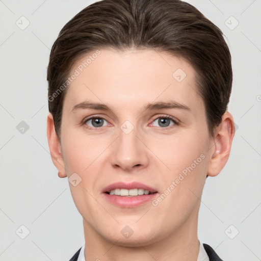 Joyful white young-adult female with short  brown hair and grey eyes