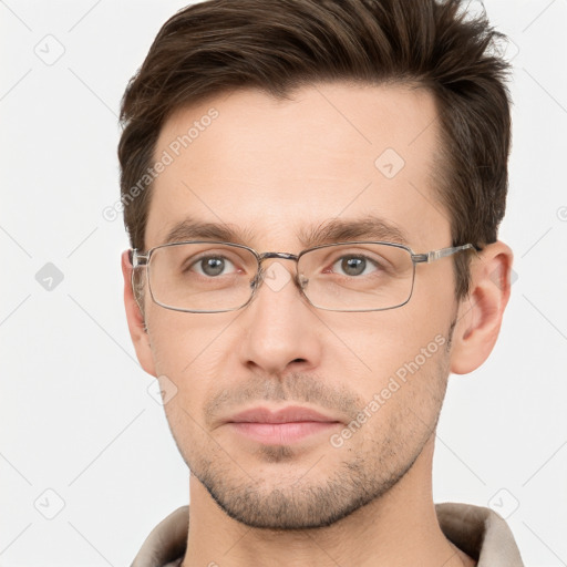 Joyful white adult male with short  brown hair and grey eyes