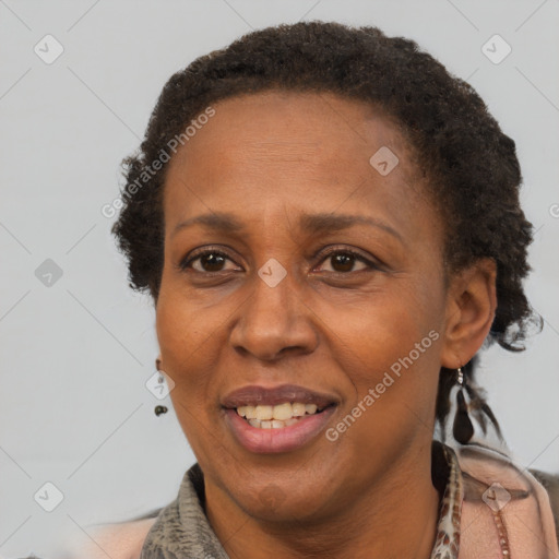 Joyful black adult female with short  brown hair and brown eyes