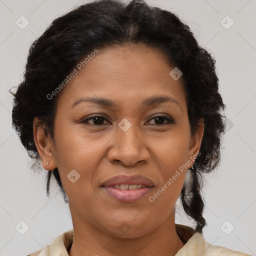 Joyful latino adult female with medium  brown hair and brown eyes