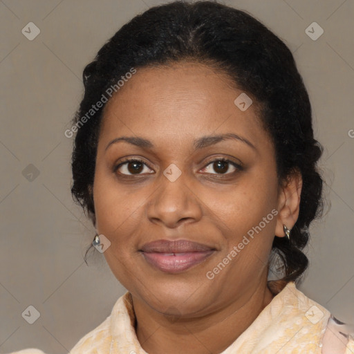 Joyful black adult female with medium  brown hair and brown eyes