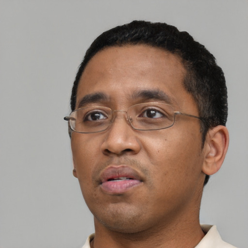 Neutral black adult male with short  black hair and brown eyes