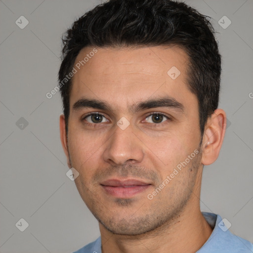 Joyful white young-adult male with short  black hair and brown eyes