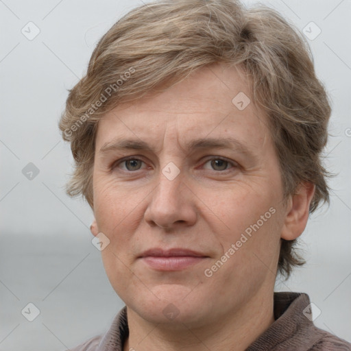 Joyful white adult male with short  brown hair and grey eyes