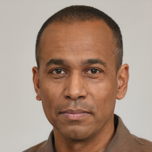 Neutral latino adult male with short  black hair and brown eyes