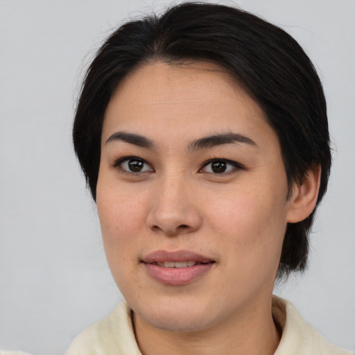 Joyful asian young-adult female with medium  brown hair and brown eyes