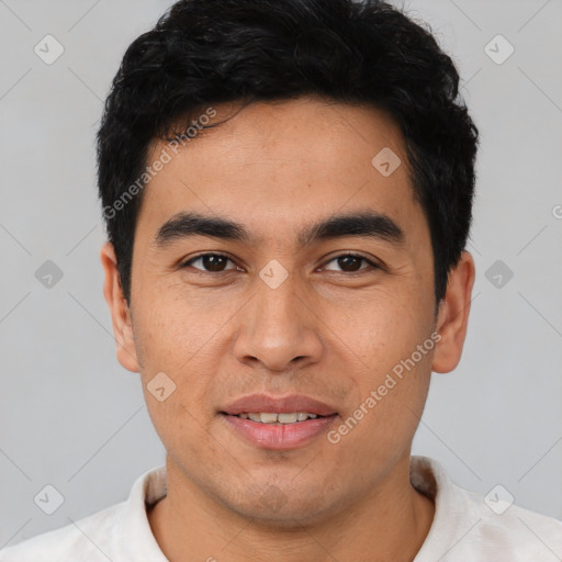 Joyful latino young-adult male with short  brown hair and brown eyes