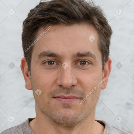 Joyful white adult male with short  brown hair and brown eyes