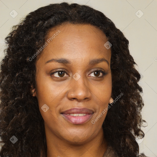 Joyful black young-adult female with long  brown hair and brown eyes