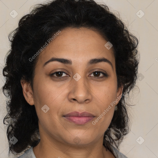 Joyful latino adult female with medium  brown hair and brown eyes