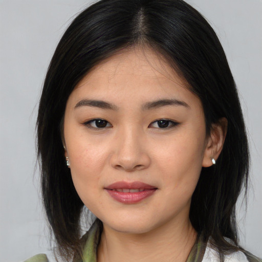 Joyful asian young-adult female with medium  brown hair and brown eyes