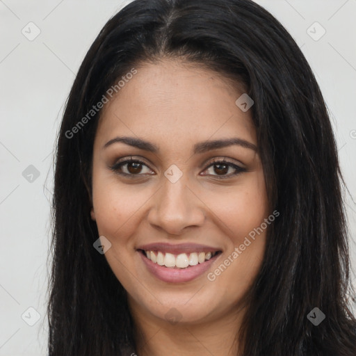 Joyful latino young-adult female with long  brown hair and brown eyes