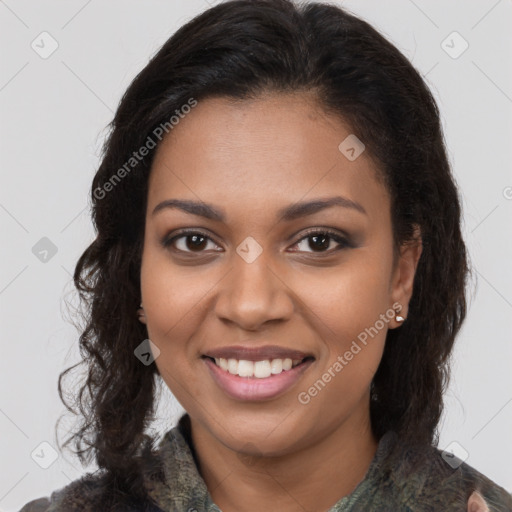 Joyful black young-adult female with long  brown hair and brown eyes