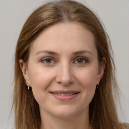 Joyful white young-adult female with long  brown hair and grey eyes