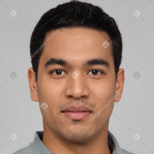 Neutral latino young-adult male with short  black hair and brown eyes