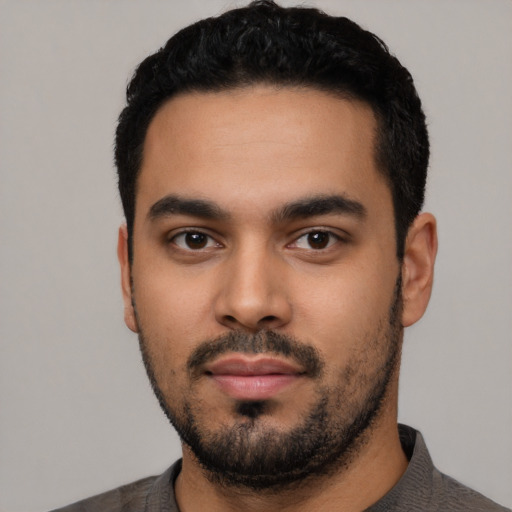 Neutral latino young-adult male with short  black hair and brown eyes