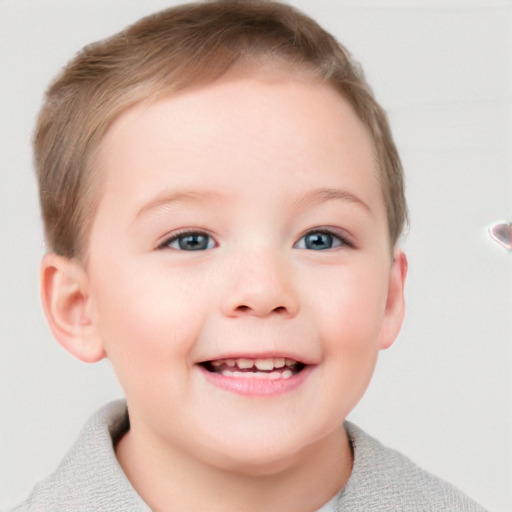 Joyful white child female with short  brown hair and blue eyes