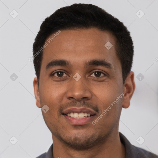 Joyful latino young-adult male with short  black hair and brown eyes