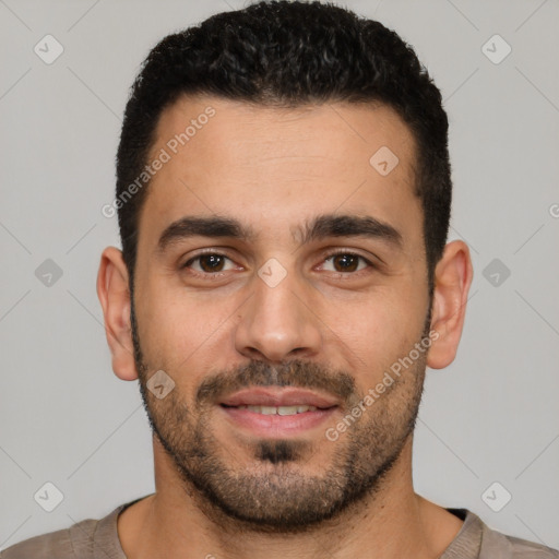 Joyful white young-adult male with short  black hair and brown eyes