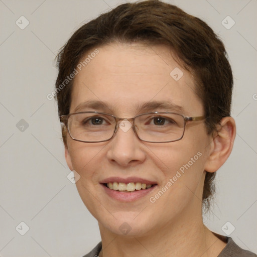 Joyful white adult female with short  brown hair and grey eyes