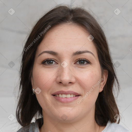 Joyful white adult female with medium  brown hair and grey eyes