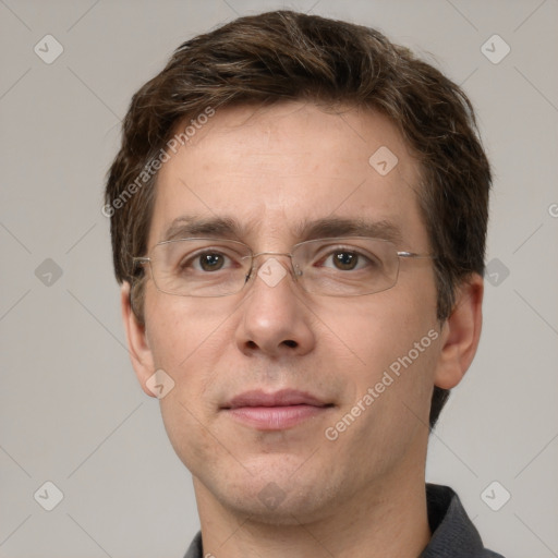 Joyful white adult male with short  brown hair and grey eyes