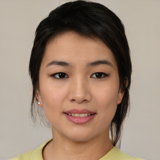 Joyful asian young-adult female with medium  brown hair and brown eyes