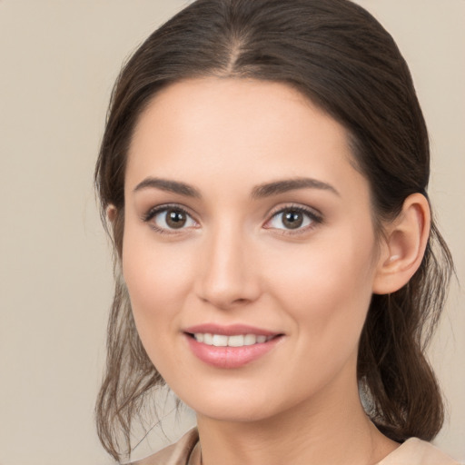 Joyful white young-adult female with medium  brown hair and brown eyes