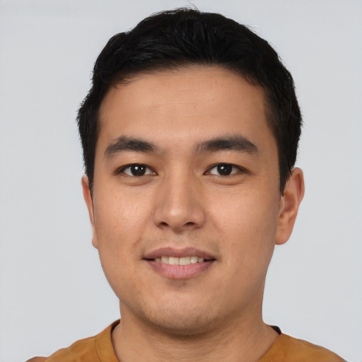 Joyful asian young-adult male with short  black hair and brown eyes
