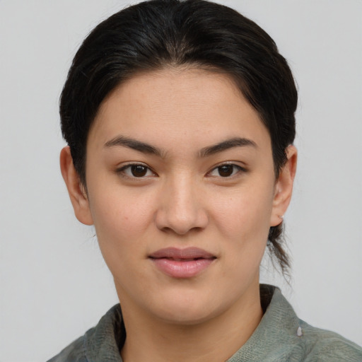 Joyful asian young-adult female with medium  brown hair and brown eyes