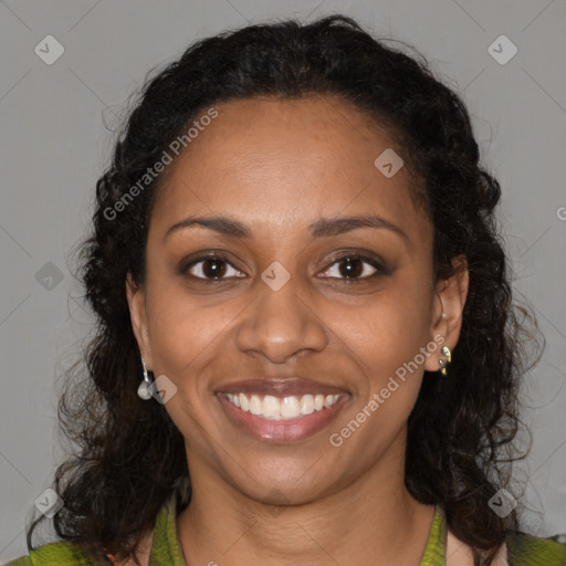 Joyful black young-adult female with medium  brown hair and brown eyes