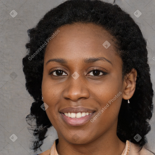 Joyful black young-adult female with long  black hair and brown eyes