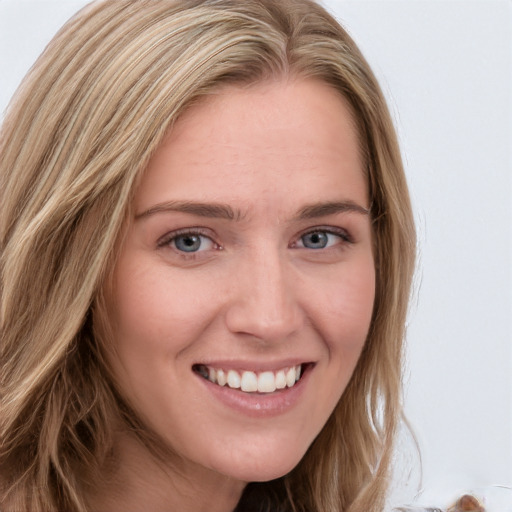 Joyful white young-adult female with long  brown hair and blue eyes