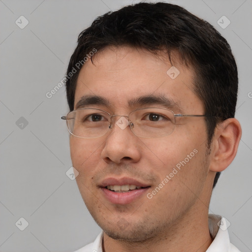 Joyful white adult male with short  brown hair and brown eyes