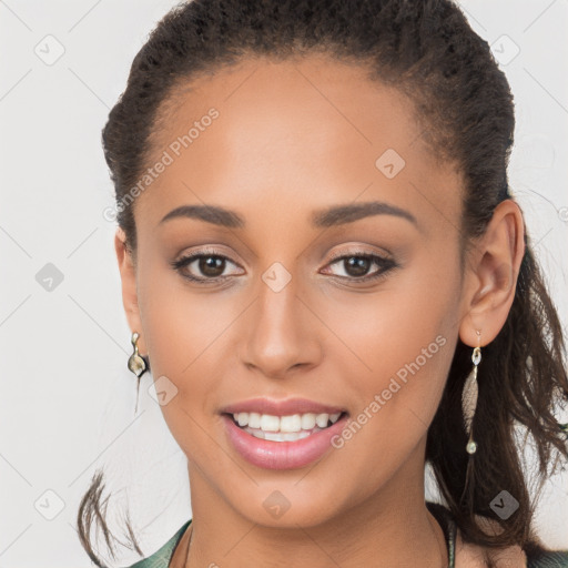 Joyful white young-adult female with long  brown hair and brown eyes