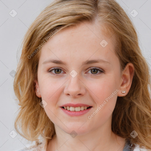 Joyful white young-adult female with medium  brown hair and blue eyes