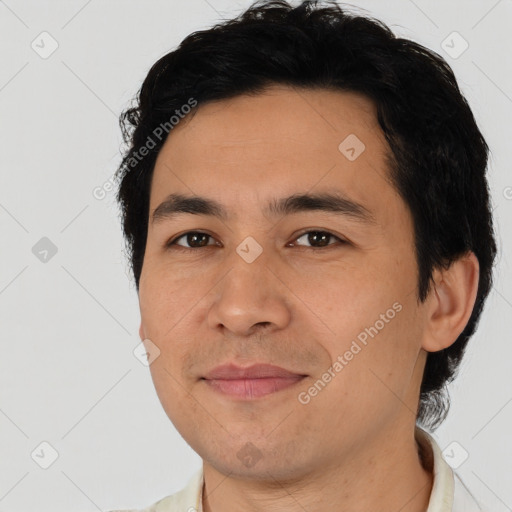 Joyful asian young-adult male with short  brown hair and brown eyes