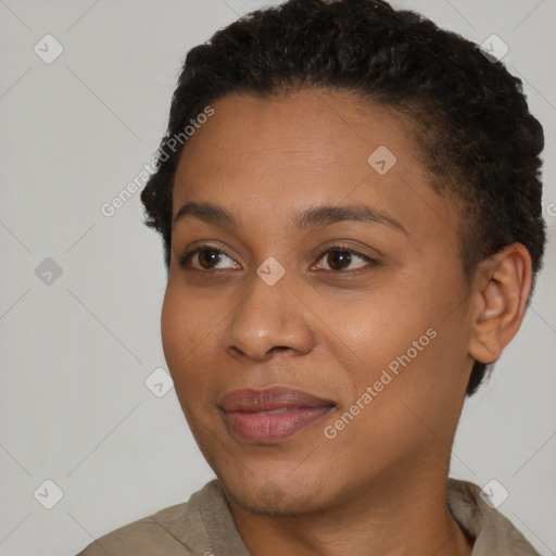 Joyful black young-adult female with short  brown hair and brown eyes