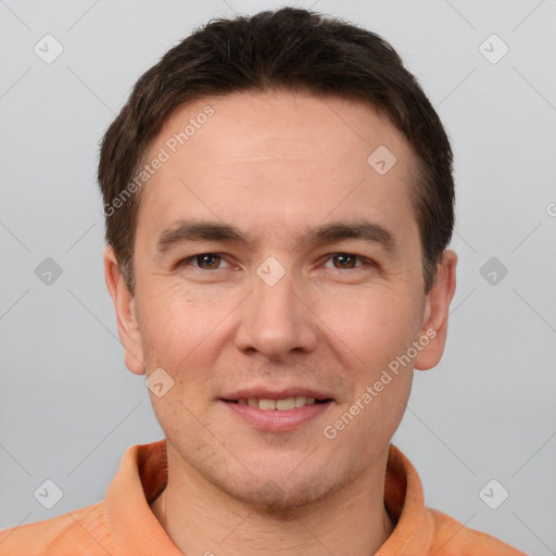 Joyful white adult male with short  brown hair and brown eyes