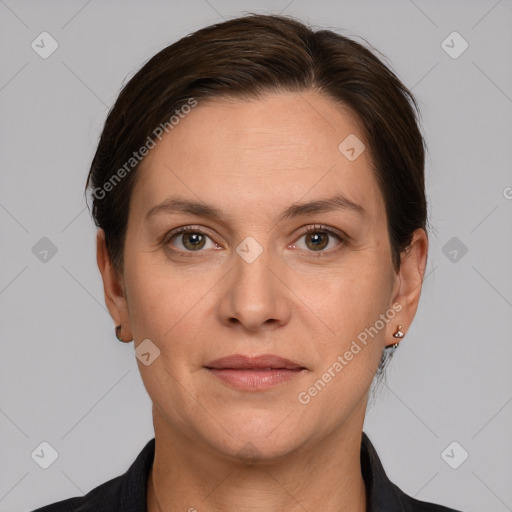 Joyful white adult female with short  brown hair and grey eyes