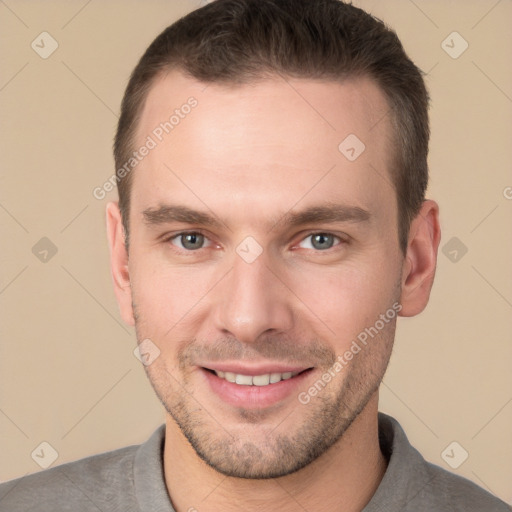 Joyful white young-adult male with short  brown hair and brown eyes