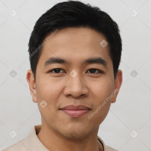 Joyful asian young-adult male with short  black hair and brown eyes